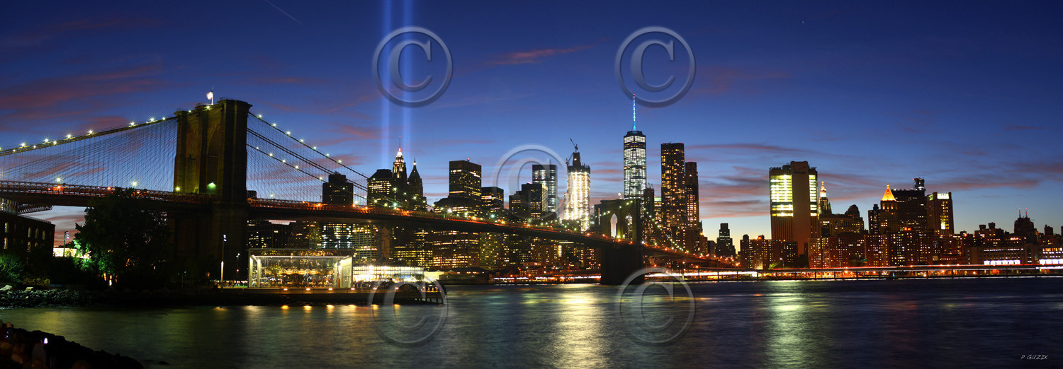 NEW YORK CITY MANHATTAN  PONT DE BROOKLYN BY NIGHT  and Tribute in Light (en français : « Hommage en lumière »)New york photo panoramique couleur  XXLFORMAT DISPONIBLE  150X52cm  33X95cm ( et 20X60cm en vente direct uniquement )pas de telechargement disponible.A chaque format correspond une éditions limitée spécifique .© collection P GUZIKA titre indicatif suivant la finition, tarif encadré vente direct:150 x 52 cm 180€33   x 95 cm   99€20   x 60 cm   39€disponible en  30 X10 cm  sur stand en vente directDISPONIBLE SUIVANT STOCK -  CRÉATION JOURNALIERE  -